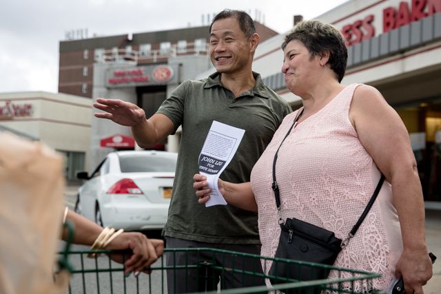 John Liu campaigns outside a Key Foods in Whitestone, Queens